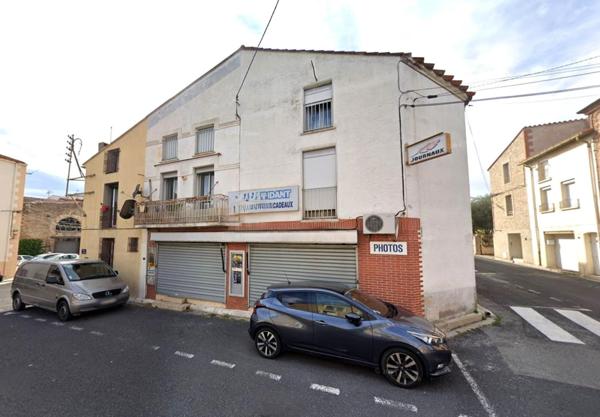 Immeuble avec ancien local pro + grand appartement