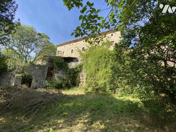  ENTRE  UZES  et ALES - MAS EN PIERRES APPRENTES A RENOVER  AVEC TERRAIN ET VUE DEGAGEE