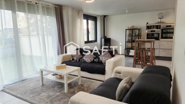 Maison mitoyenne entièrement rénovée avec garage et jardin, idéale famille