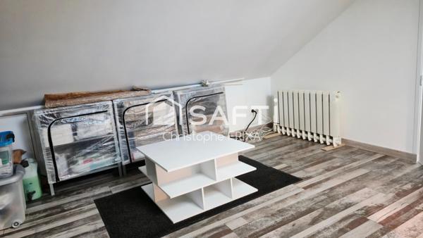 Maison mitoyenne entièrement rénovée avec garage et jardin, idéale famille