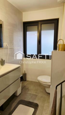 Maison mitoyenne entièrement rénovée avec garage et jardin, idéale famille