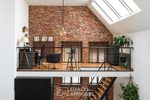 Loft d’exception aux volumes spectaculaires dans un ancien cinéma