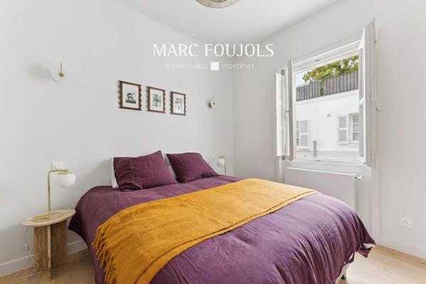 REZ-DE-JARDIN A LA BUTTE MONTMARTRE.