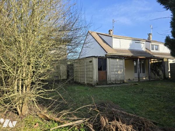 Maison semi mitoyenne sur une parcelle de 443m² 3 chambres jardin garage