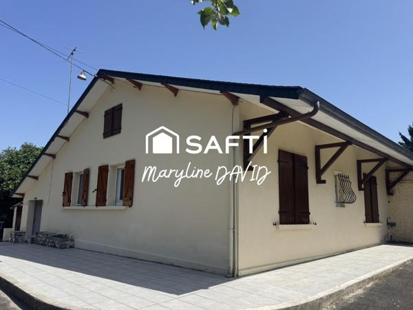 Maison de plain-pied de 100m², jardin et garages