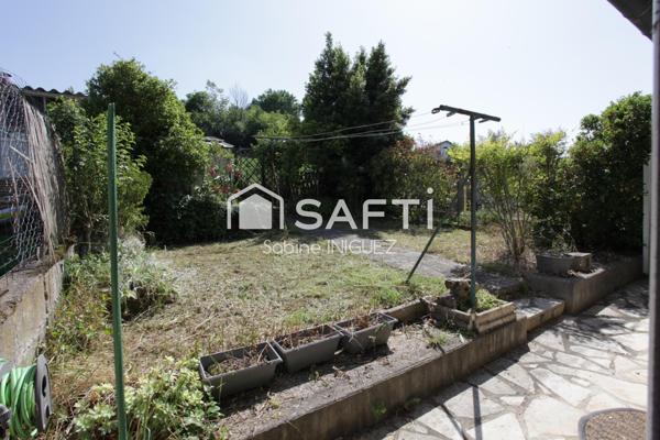 MAISON DE VILLE AVEC GARAGE ET JARDIN