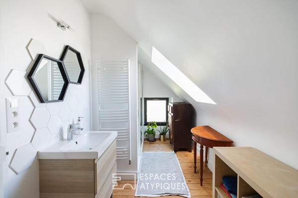 Maison de ville rénovée, volumes traversants et jardin paysagé