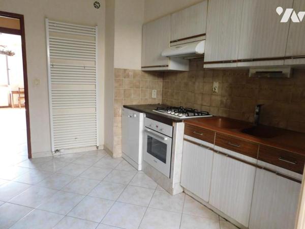 Maison de ville avec garage et jardin