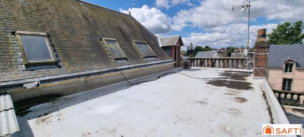 Immeuble : 11 studios, 1 appartement et 1 local commercial.