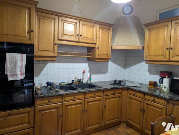 Immeuble composé de 3 appartements + caves en sous-sol 