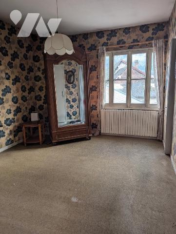 Immeuble composé de 3 appartements + caves en sous-sol 