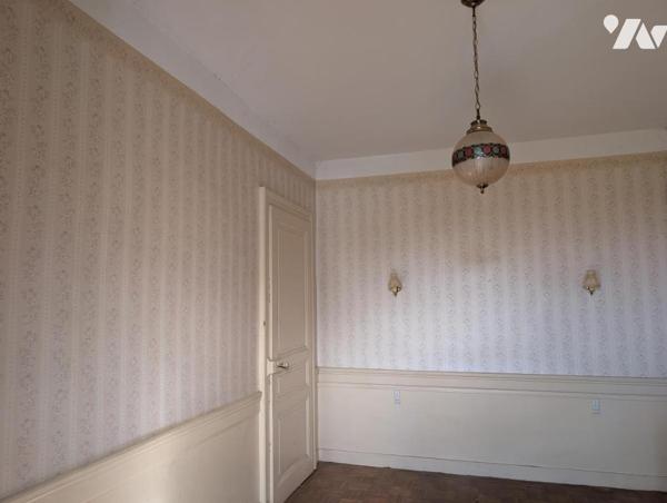 Immeuble composé de 3 appartements + caves en sous-sol 