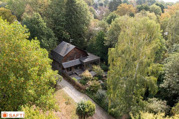 Propriété nichée au sein d'un parc arboré de 5565 m2