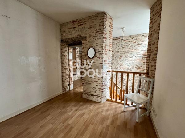 Local commercial + Habitation