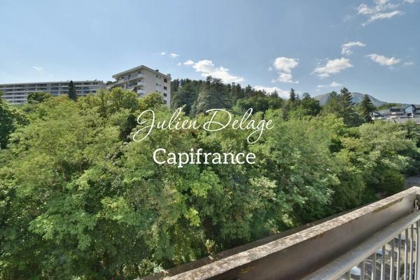 Appartement T3 traversant à rénover avec balcon, cave et parking privatif