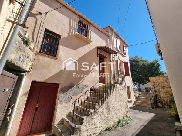 Maison avec terrasse, à côté d'un parking gratuit