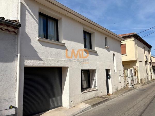 Maison de ville garage bain romain solarium et cour