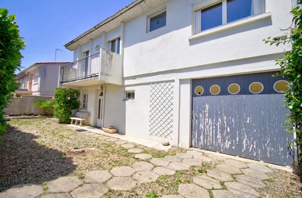 AGEN - Maison de 126 m² composée de 4 chambres, d'une terrasse couverte et d'un garage fermé.