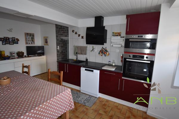 Maison avec terrain attenant constructible