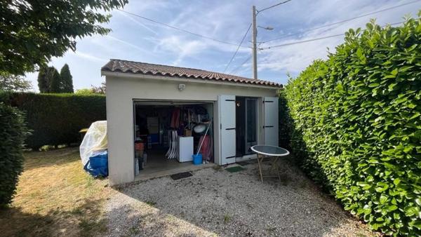 Mobil home avec assainissement, garage et jardin