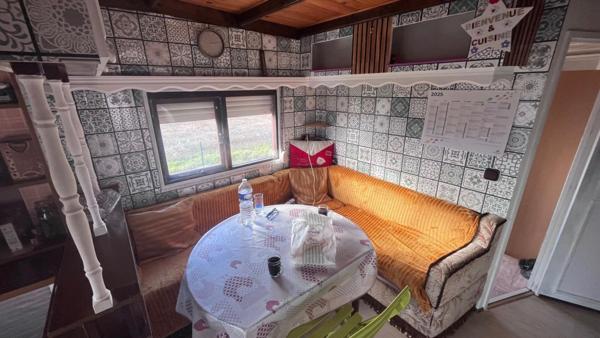 Mobil home avec assainissement, garage et jardin