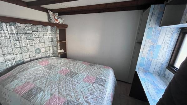 Mobil home avec assainissement, garage et jardin