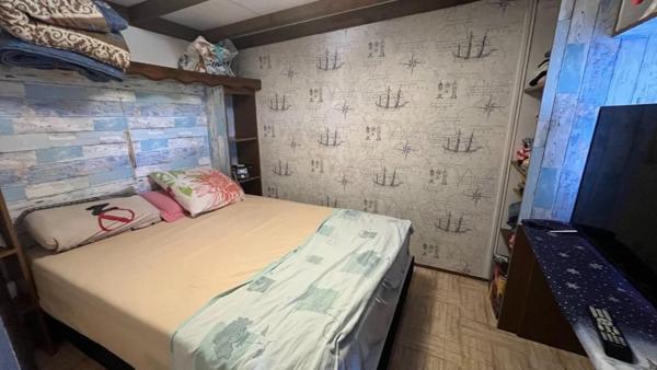 Mobil home avec assainissement, garage et jardin