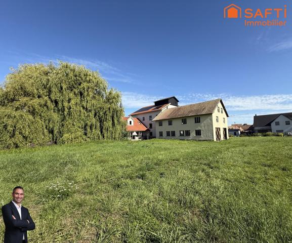 Superbe appartement de 4 pièces disposant d'une terrasse, d'un jardin, d'un double garage et de 2 places de stationnement privées !