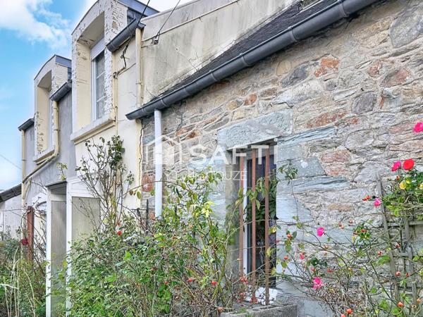 Maison à rénover avec jardin, pleine de potentiel