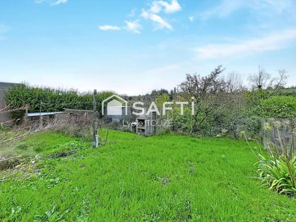 Maison à rénover avec jardin, pleine de potentiel