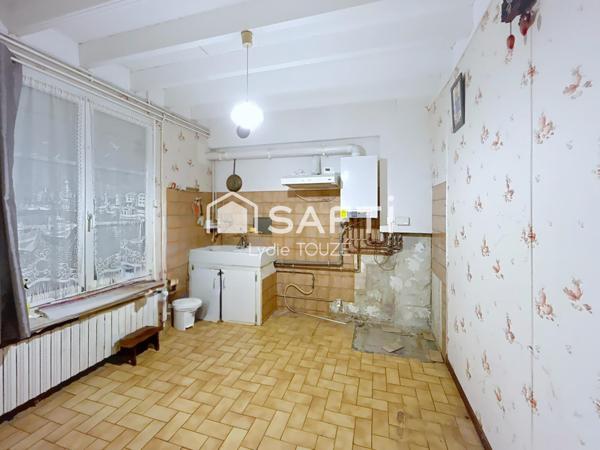 Maison à rénover avec jardin, pleine de potentiel