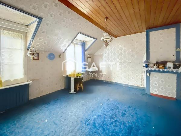 Maison à rénover avec jardin, pleine de potentiel