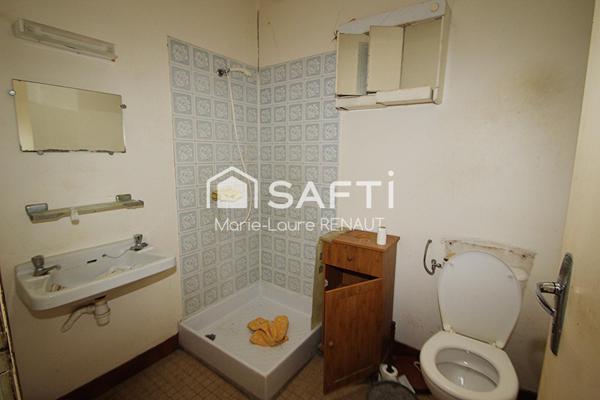 Maison de ville à rénover - 2 chambres - Petite terrasse et cave en sous-sol