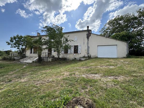 Maison en pierre avec dépendance et terrain