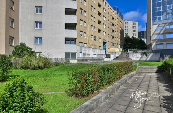 CLUIRE - Appartement 1 Pièce avec terrasse et place de stationnement couverte