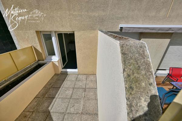 CLUIRE - Appartement 1 Pièce avec terrasse et place de stationnement couverte