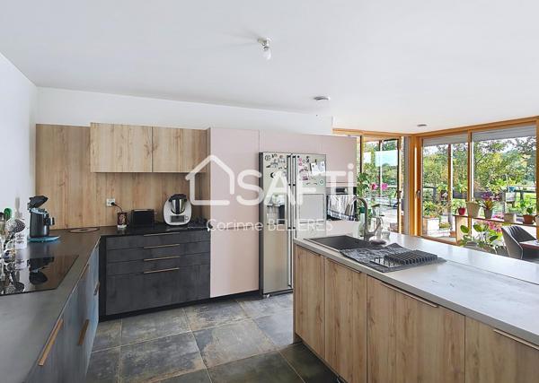 Maison en ossature bois de 214m² avec grand terrain boisé