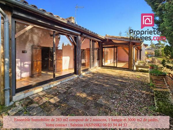 Ensemble immobilier, deux maisons, double garage et grand jardin
