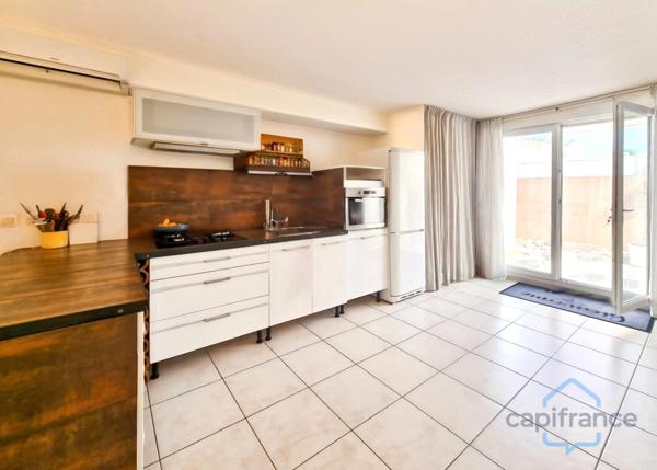 Appartement de 120m² avec 6 pièces - Terrasse et terrain privatif de 170m² - Parkings