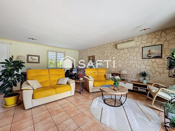 Jolie maison de 84 m2 avec un grand garage et un jardin arboré