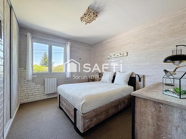 Jolie maison de 84 m2 avec un grand garage et un jardin arboré