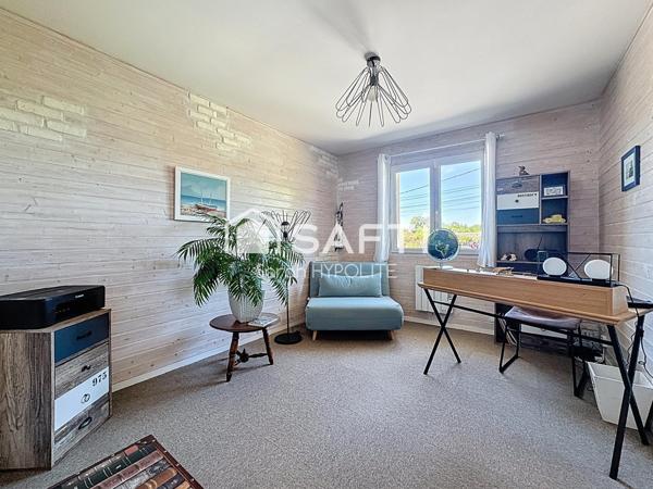 Jolie maison de 84 m2 avec un grand garage et un jardin arboré