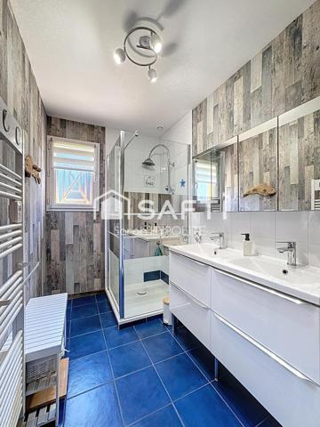 Jolie maison de 84 m2 avec un grand garage et un jardin arboré