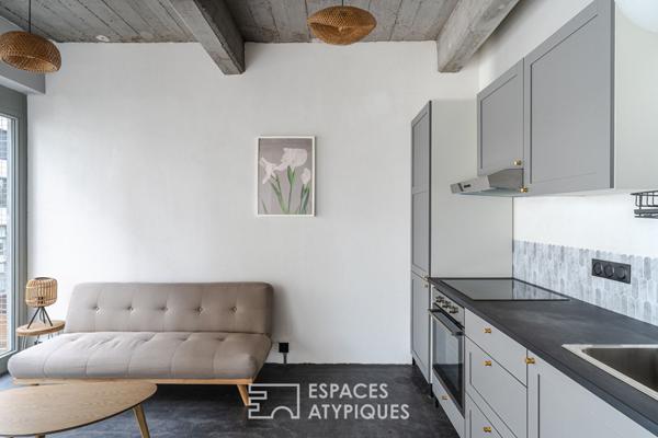 Petit loft style industriel et sa terrasse quartier Coop