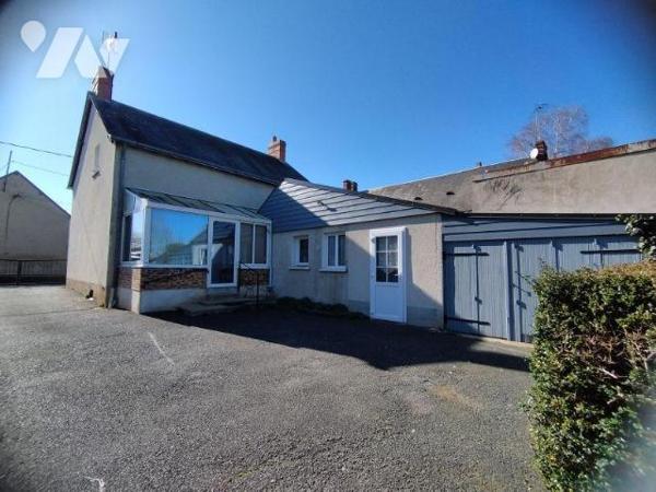 Maison élevée sur cave pour partie, composée au rez-de-chaussée:
- véranda, cuisine aménagée, ...