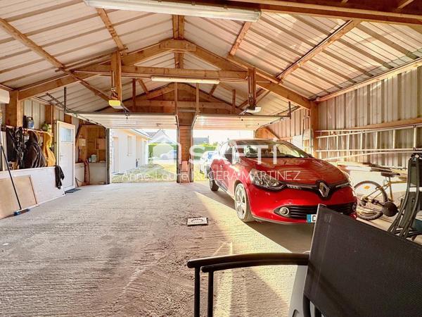 Maison 4 chambres avec véranda, buanderie, garage, hangar et serre