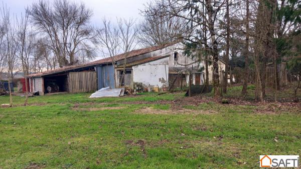 Parcelle 1ha18 maison semi-enterrée 90m2 , dépendances agricoles