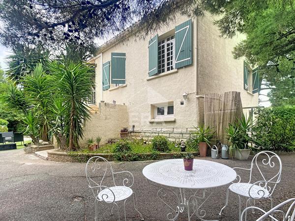 Bâtisse de 2 logements + parcelle de terrain constructible