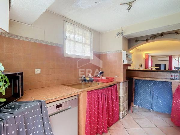 Bâtisse de 2 logements + parcelle de terrain constructible