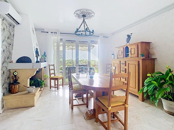 Bâtisse de 2 logements + parcelle de terrain constructible